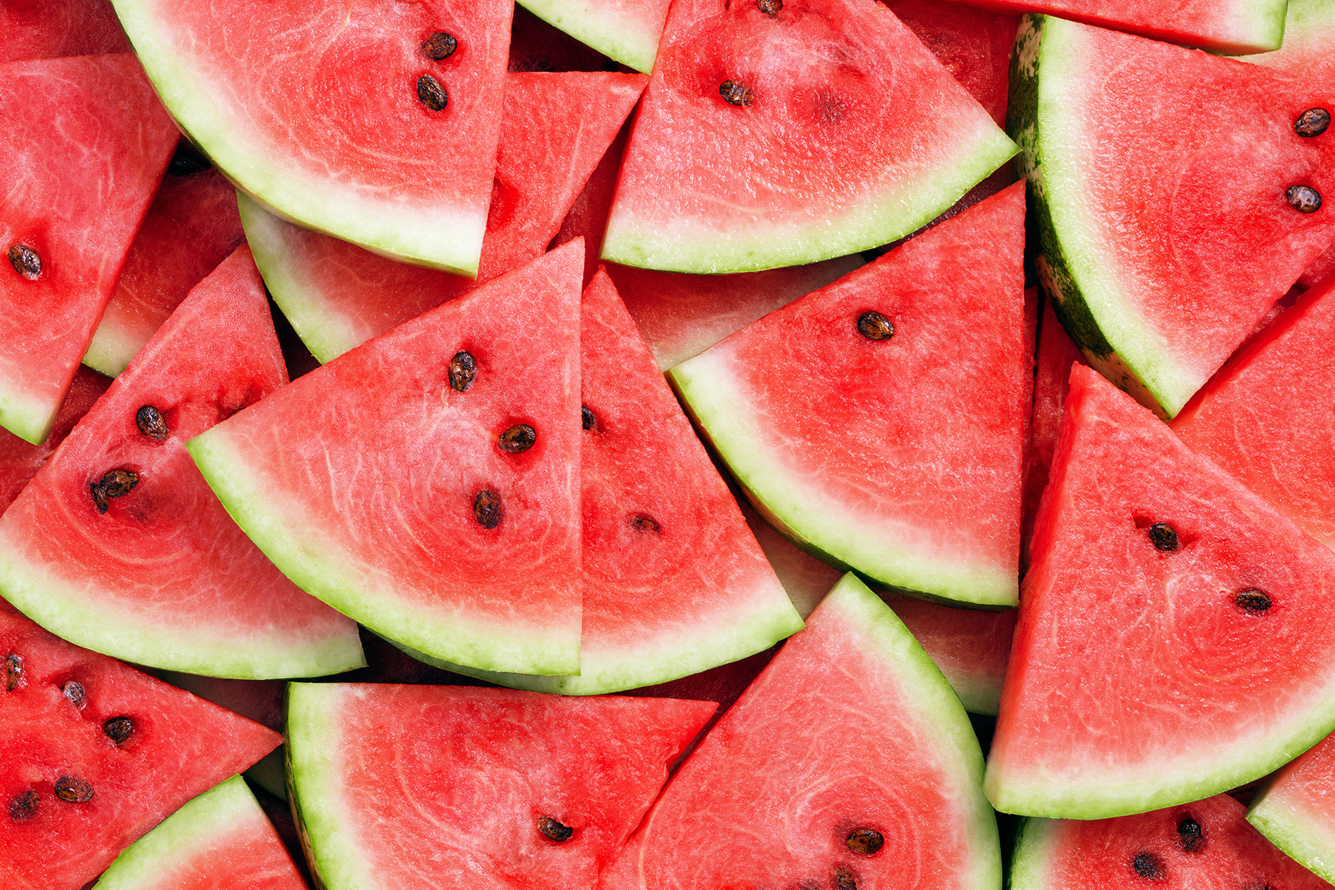 heap of fresh sliced watermelon as textured background